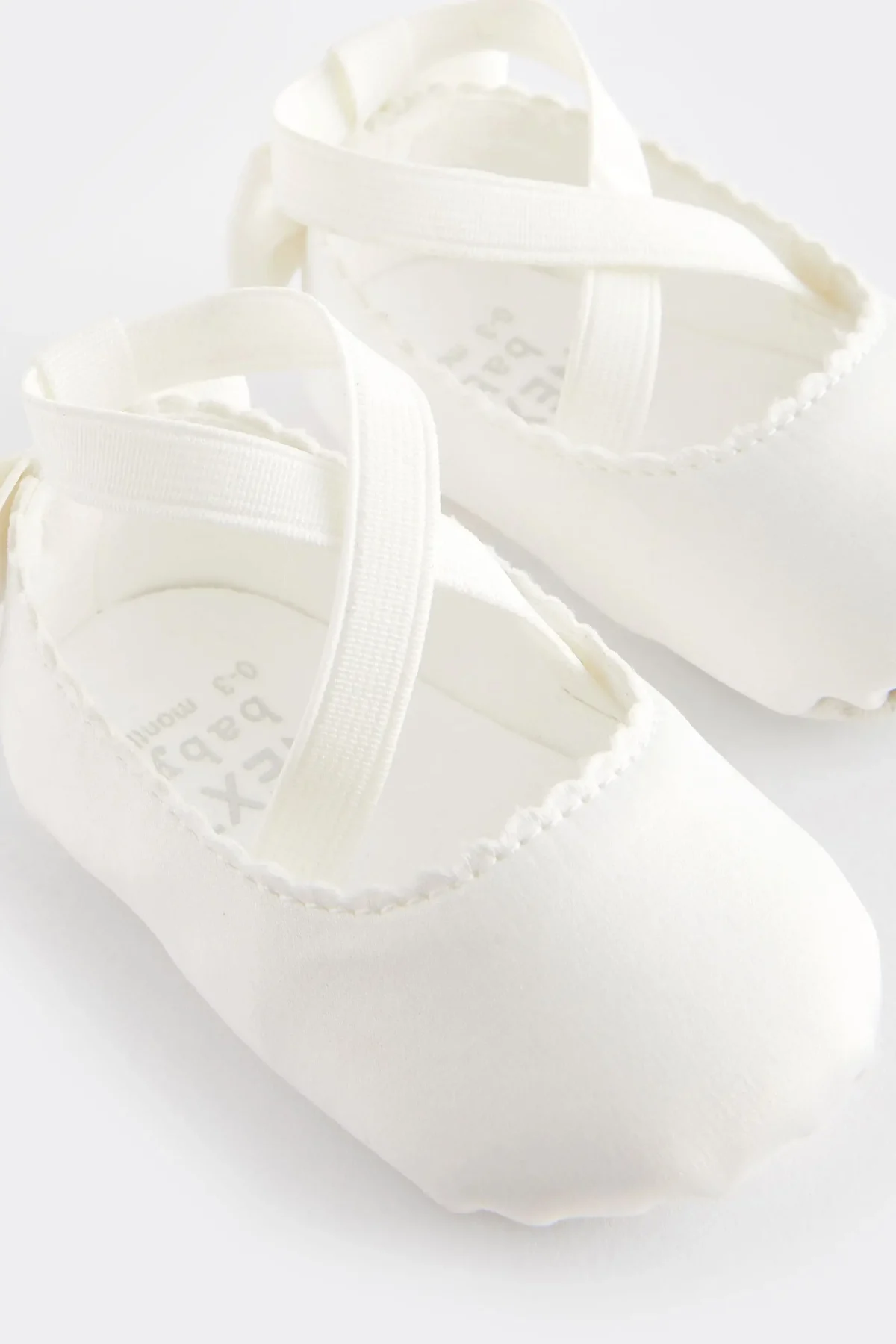 White baby a booties scaled